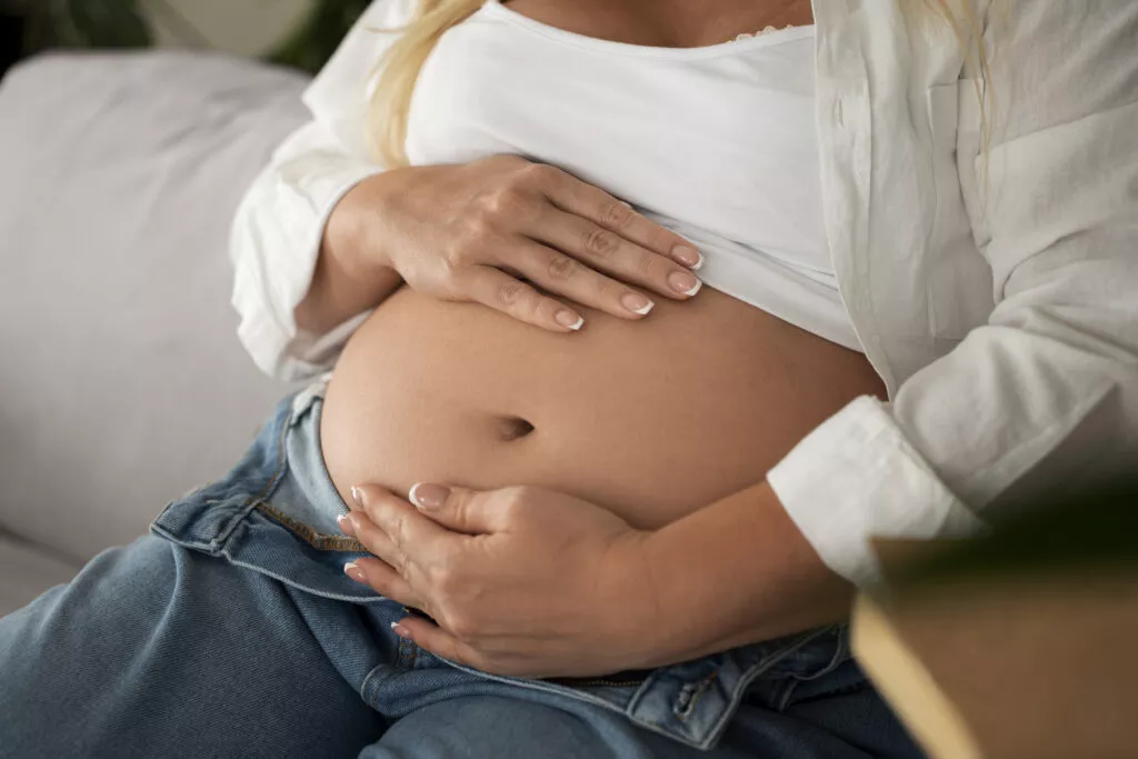 high angle pregnant woman spending time indoors