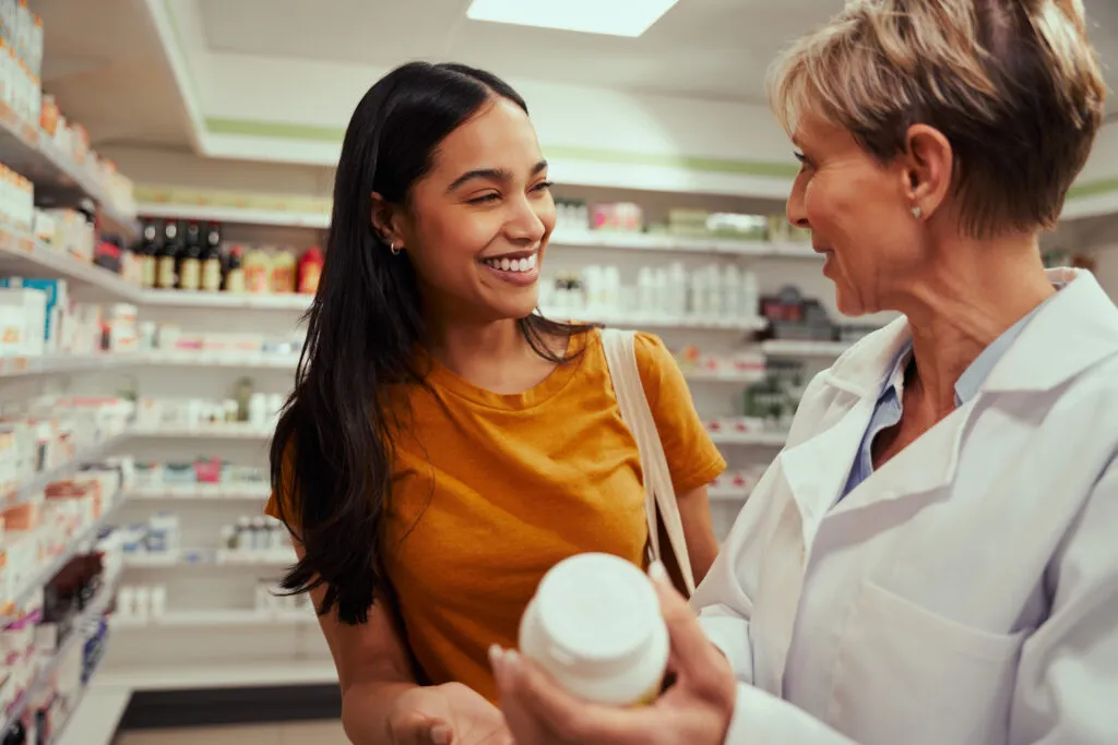 senior pharmacist assisting buying medical drug buyer pharmacy drugstore